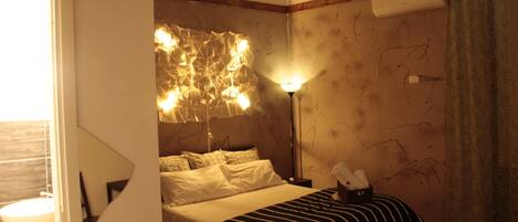 Deluxe Quadruple Room (Libri) | Iron/ironing board, cribs/infant beds, rollaway beds, free WiFi