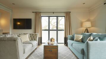 Riverside Suite | Living area | Flat-screen TV