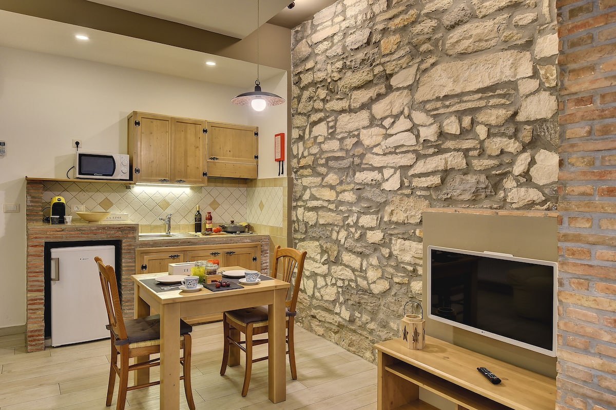 Comfort Studio, 1 Queen Bed, Kitchen, Garden Area | Living area | 32-inch flat-screen TV with satellite channels, Smart TV