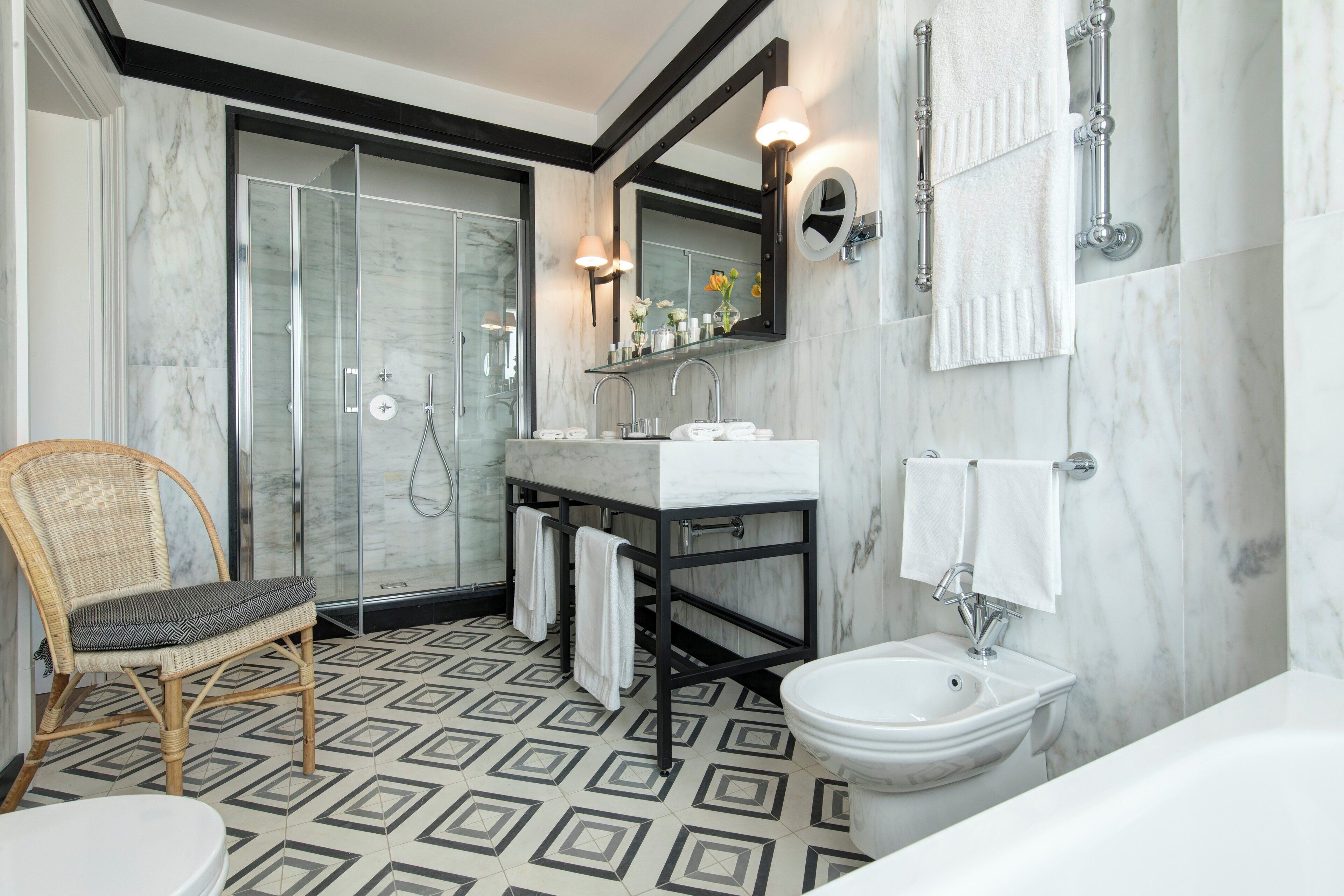 combined shower/bathtub, designer toiletries, hair dryer, bathrobes