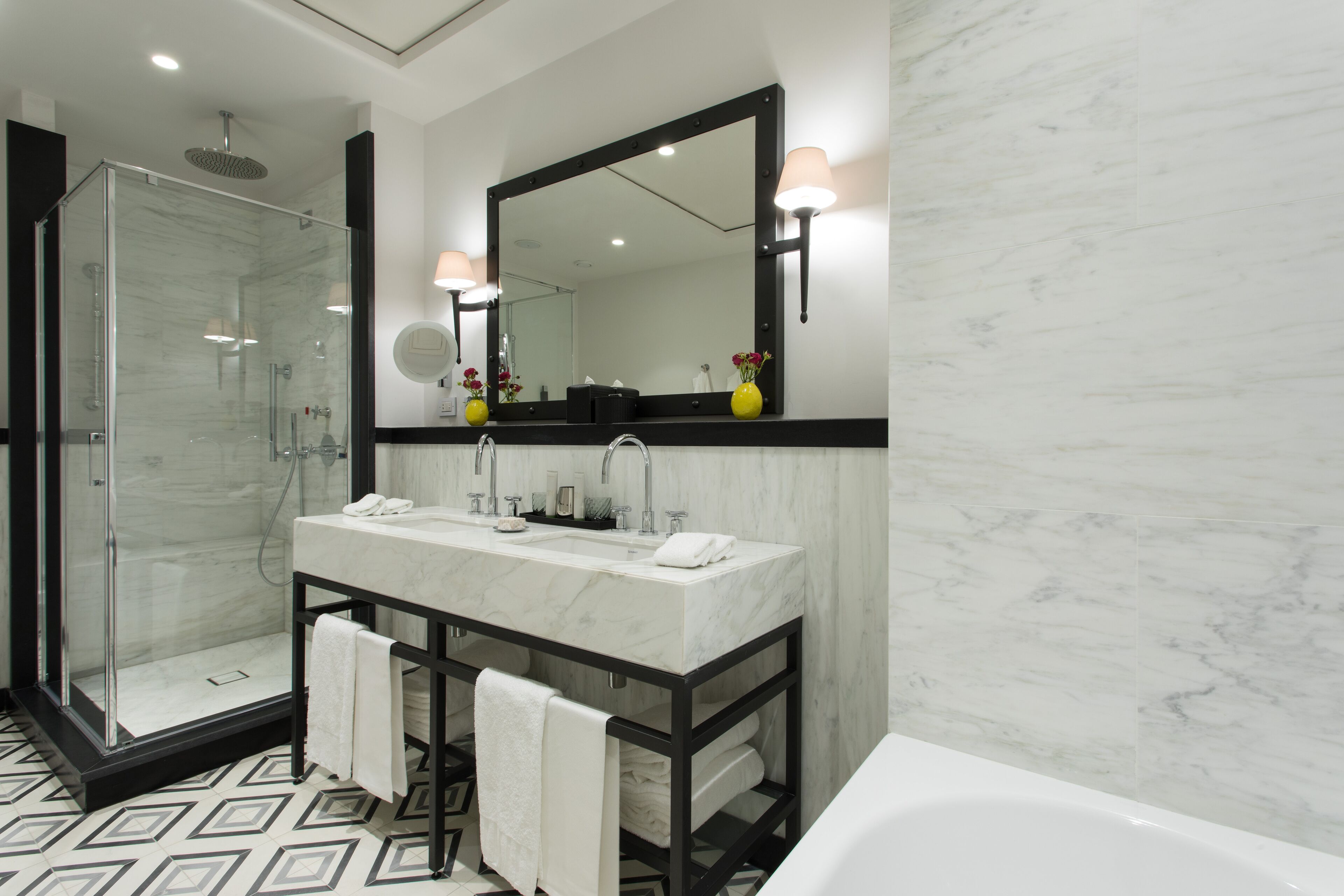 combined shower/bathtub, designer toiletries, hair dryer, bathrobes