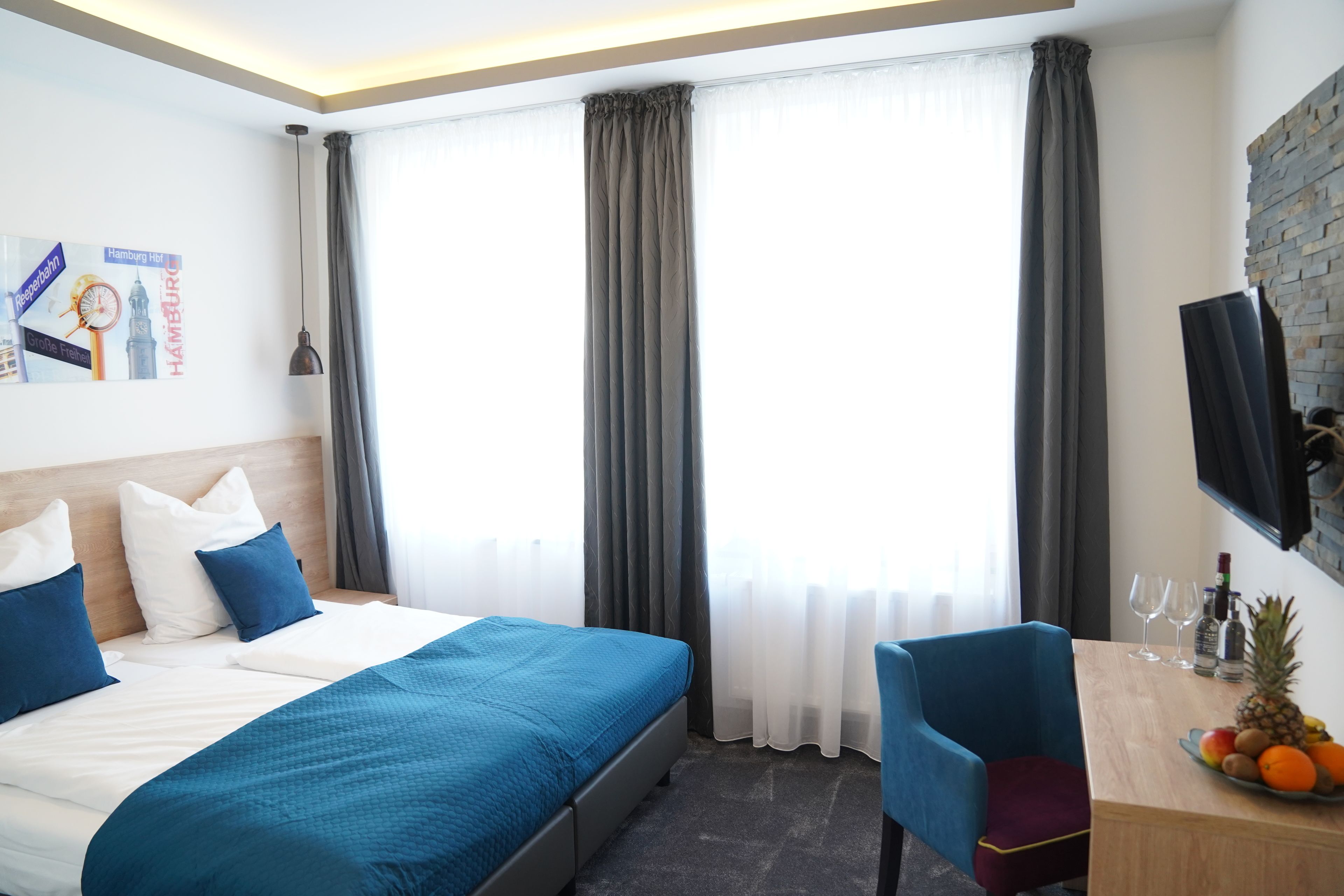 Double or Twin Room | Down comforters, desk, laptop workspace, blackout drapes