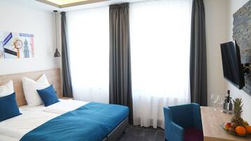 Double or Twin Room | Down comforters, desk, laptop workspace, blackout drapes