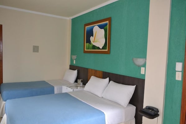 Triple Room | Minibar, desk, blackout drapes, free WiFi