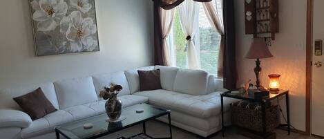 Living room with white leather sectional