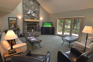 TV, fireplace - Riverfront Escape with A/C, Hot Tub and Scenic Views (Sunriver)