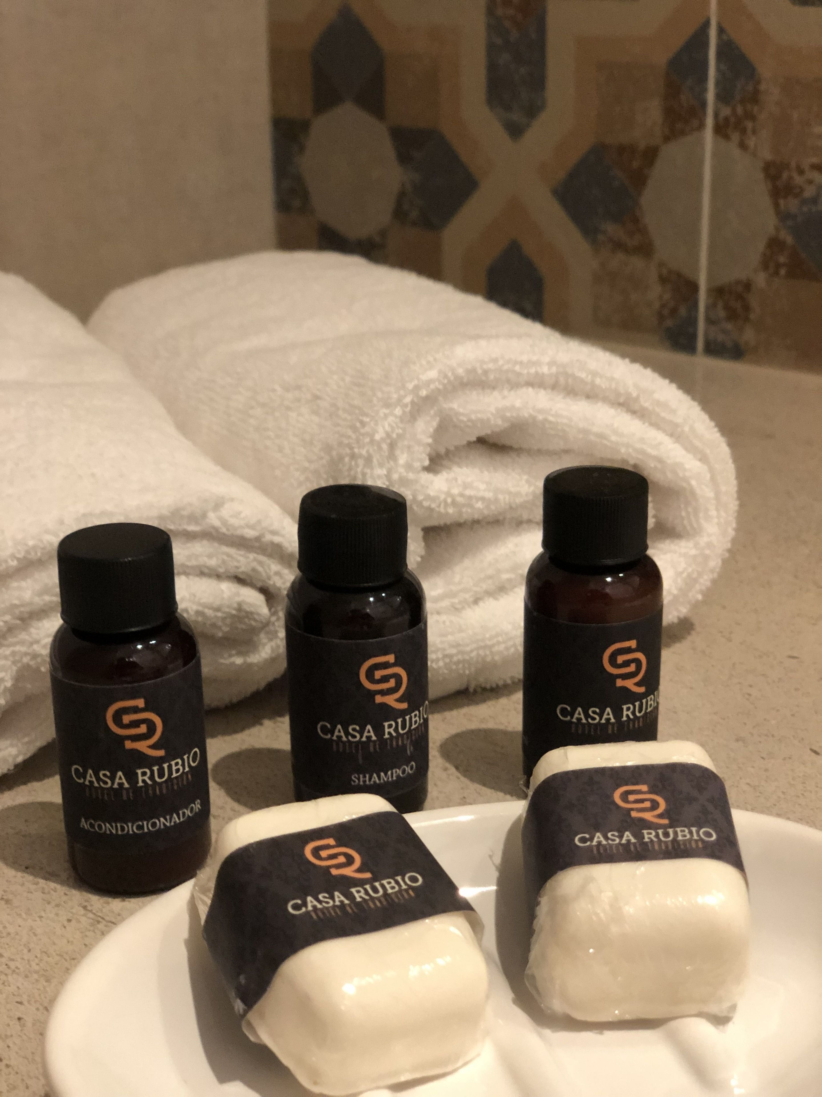 shower, rainfall showerhead, hair dryer, towels