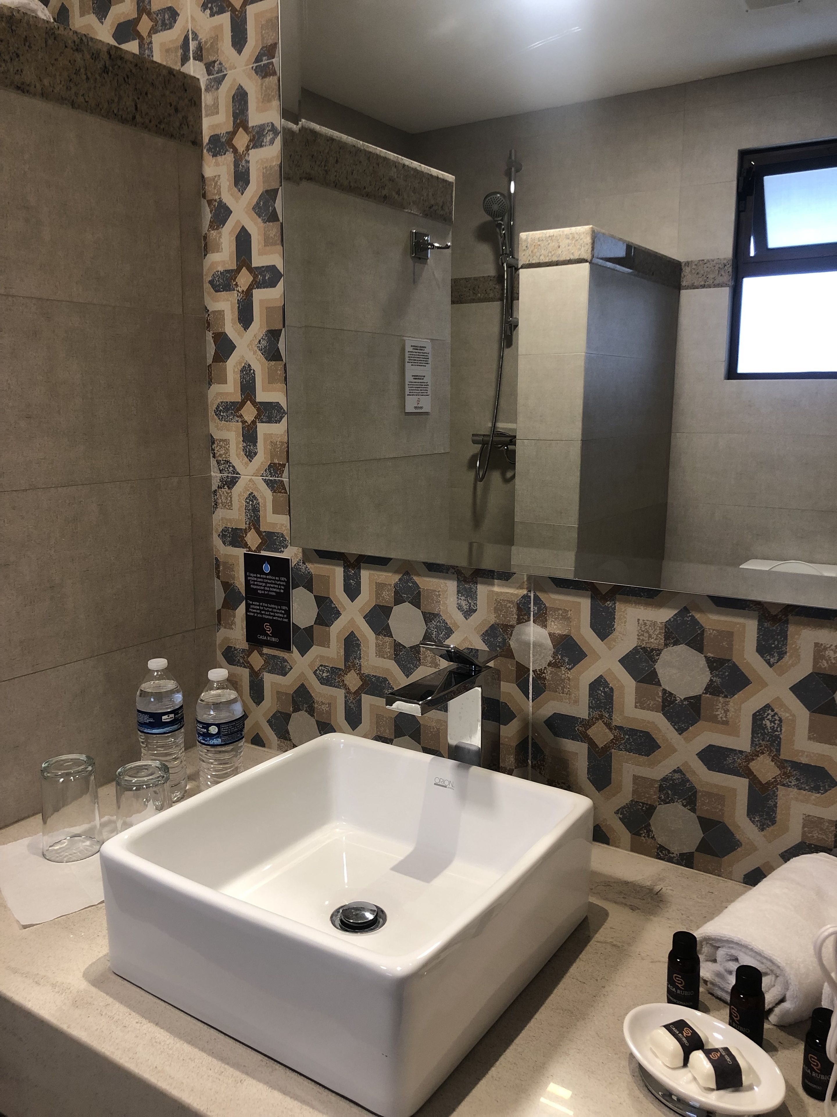 shower, rainfall showerhead, hair dryer, towels