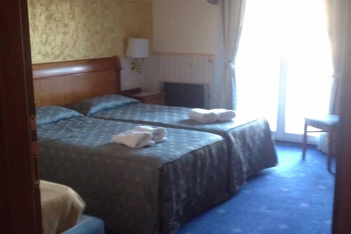 family triple room, lake view | in-room safe, blackout curtains, soundproofing, iron/ironing board