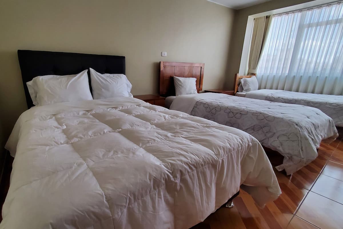 Family Quadruple Room | In-room safe, desk, laptop workspace, blackout curtains