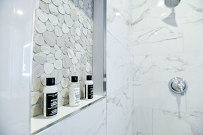 Combined shower/tub, hair dryer, towels, soap