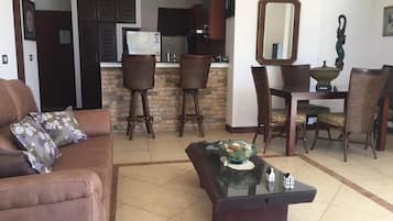 Comfort Apartment, Ocean View | Living room | Flat-screen TV