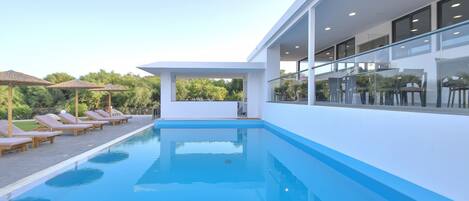 Outdoor pool, pool umbrellas, pool loungers