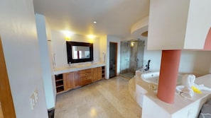 A modern bathroom with a large mirror, a bathtub, and a shower area.