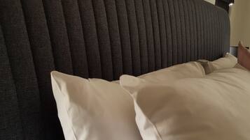 Premium bedding, pillow-top beds, blackout curtains, iron/ironing board
