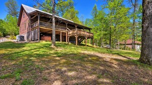A rustic cabin with a balcony, surrounded by trees and a clear sky. - Cozy Trenton Cabin w/ Spa ~ 15 Mi to Lookout Mtn! (Trenton)