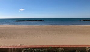 On the beach, sun loungers