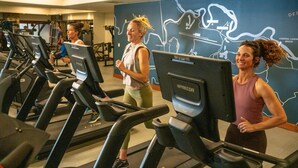 A gym with treadmills, a wall map, and exercise equipment. - Rustic Retreat with Access to Exclusive Golf (Sunriver)