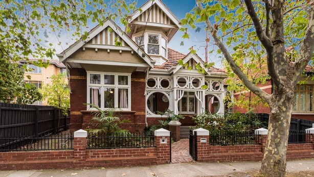 A Victorian-style house with a prominent bay window, brick facade, and a small tower-like structure. - Pet Friendly - Elwood Eclectic Gem Walk to St Kilda beach - Flexible Home offering 4 or 6 Bedrooms. (Elwood)