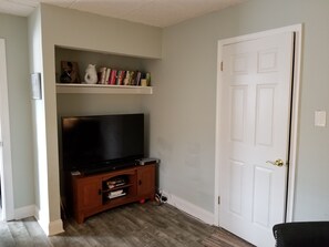 Relax in this inviting space with a flat-screen TV and a cozy reading nook.