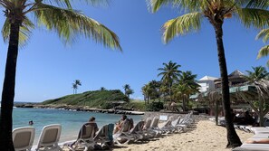 Private beach, white sand, sun loungers, beach bar