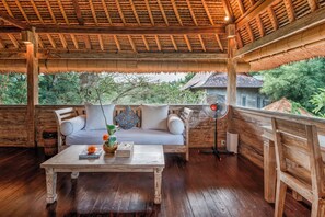 Honeymoon Villa, 1 Bedroom, Pool View | Living area | 32-inch flat-screen TV with cable channels, TV