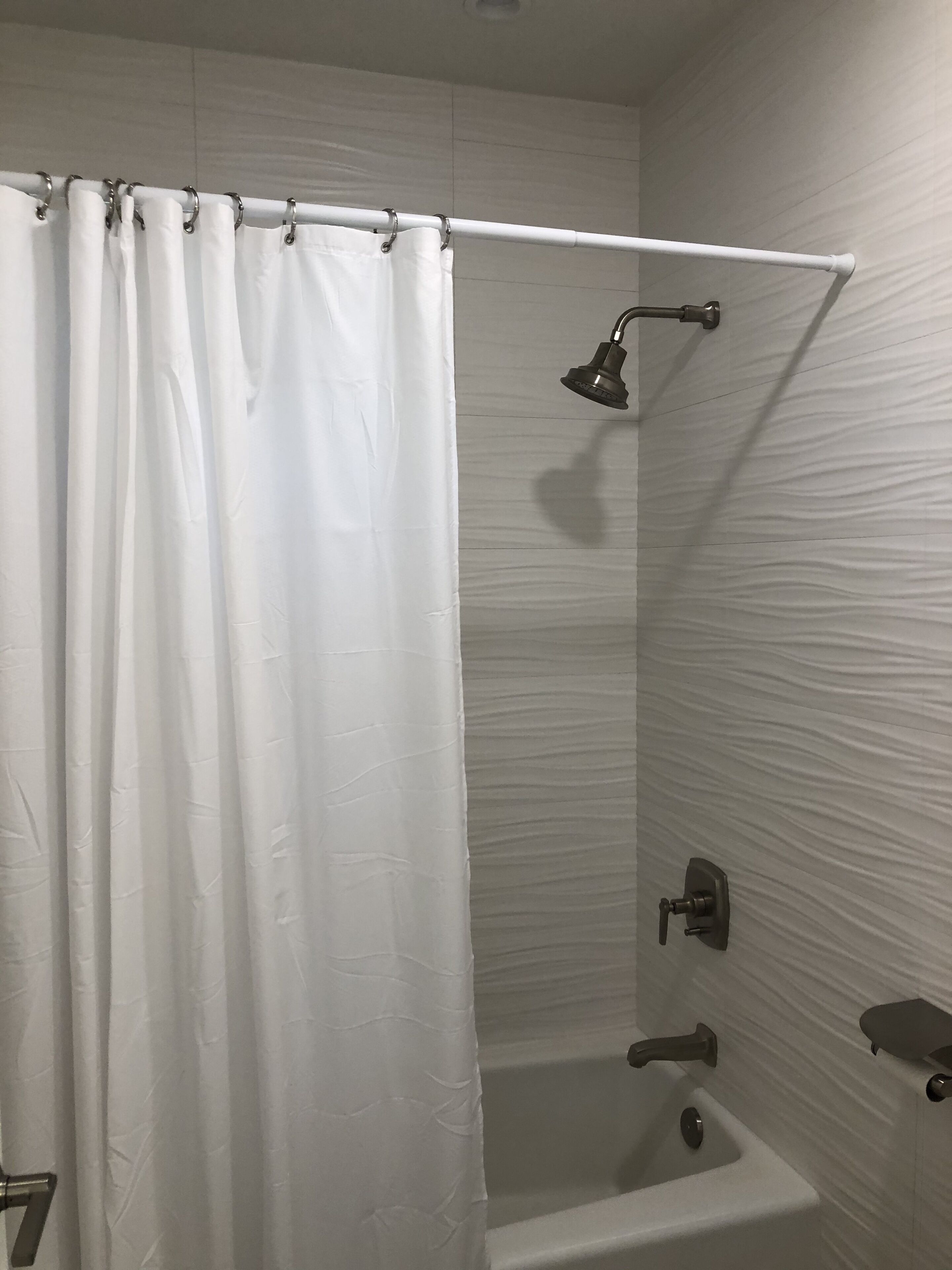 Bathtub, hair dryer, towels, soap