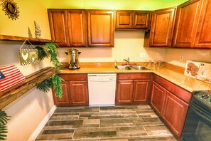 Microwave, coffee/tea maker, cookware/dishes/utensils, dining tables