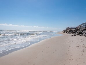 On the beach, sun-loungers