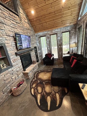 Smart TV, fireplace, video game console, table football