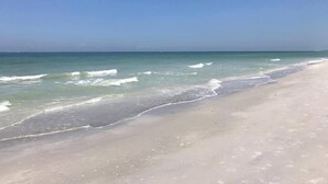 A beach with clear skies and calm waves. - Loggerhead Cay #322 - Sanibel Island Beach View (Sanibel)