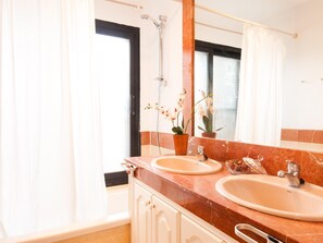 Bathtub, hair dryer, towels