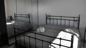 A bedroom with a bed, a wardrobe, and a mirror. - SKYLINE Penthouse Apartment Cap-D'ail, Monaco (Cap-d'Ail)