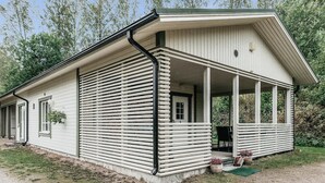 A single-story building with a covered porch and a small garden area. - Vacation home B by Interhome (Porvoo)
