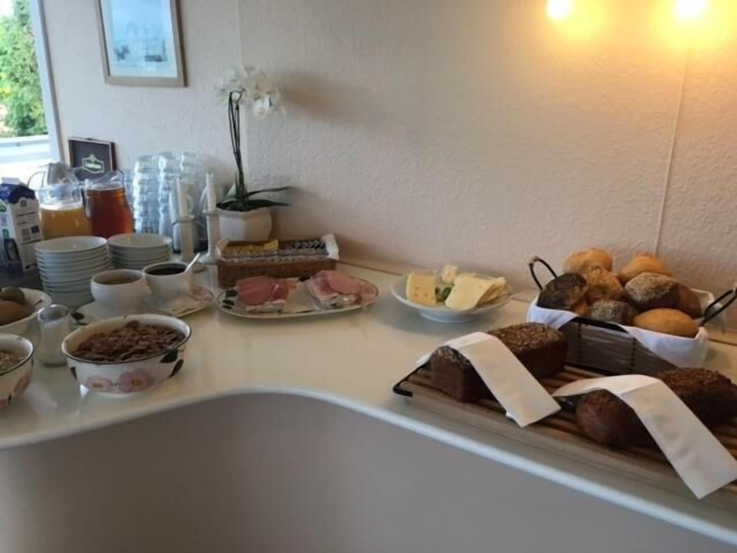 A breakfast buffet with various food items and beverages.