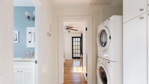 A laundry room with a ceiling fan, a washing machine, and a dryer. - Chic Craftsman, Walk Downtown (Durham)