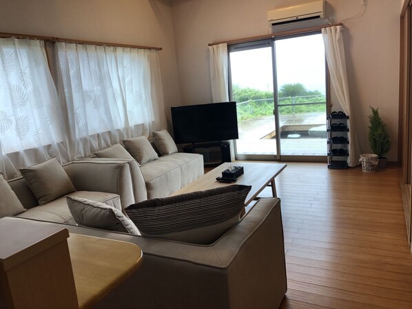 Private Vacation Home | Living room | Flat-screen TV - Ocean Villa Okinoerabu (Wadomari)