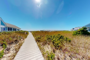 Stroll along the beachfront path to your coastal retreat.