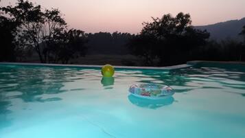 Outdoor pool, open 9:00 AM to 7:00 PM, pool loungers