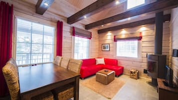 Comfort Chalet, Sauna, Courtyard View | Living room | Flat-screen TV, fireplace