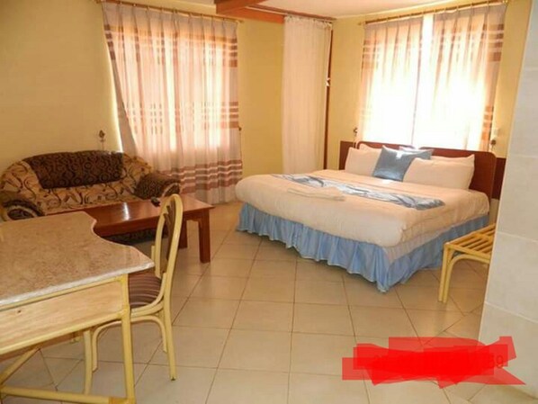 Premium bedding, memory-foam beds, desk, laptop workspace