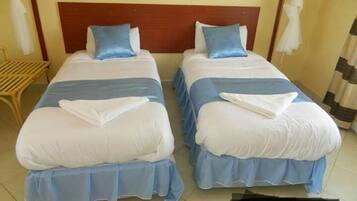 Twin Room | Premium bedding, memory-foam beds, desk, laptop workspace