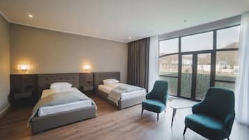 Superior Twin Room | Minibar, in-room safe, laptop workspace, iron/ironing board