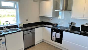 Family House, 3 Bedrooms, Non Smoking (Grassmead) | Private kitchen | Full-sized fridge, microwave, oven, stovetop