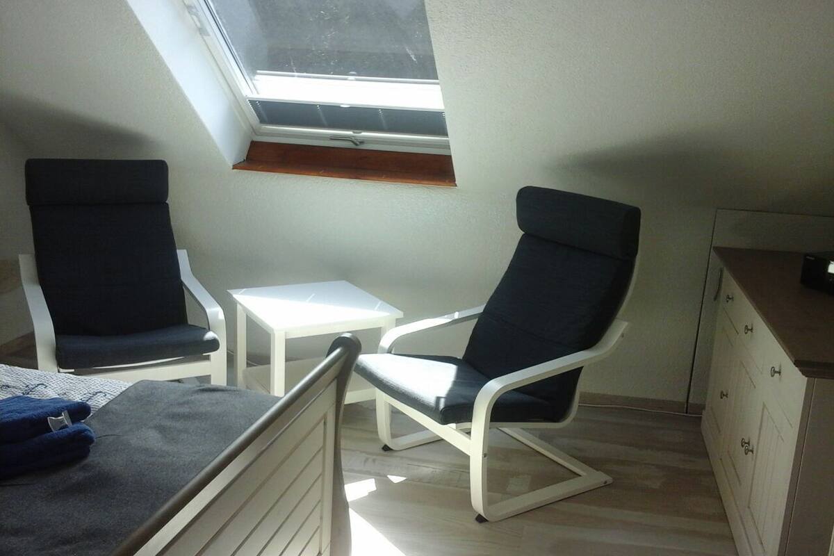 Standard Apartment | Living area | 50-inch TV with satellite channels
