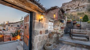 A stone building with a sign reading "The Rupestrian House Cappadocia". - The Rupestral House Hotel (Nevsehir)