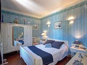 A bedroom with a bed, dresser, and nightstands. - Charming Cottage with Terrace and Garden, Pets Welcome (Bussières)