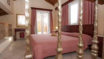 Family Duplex, Multiple Beds, Garden View | 1 bedroom, in-room safe, individually decorated, blackout drapes