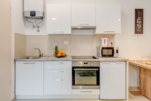 Apartamento | Cozinha privada | Geladeira, chaleira elétrica