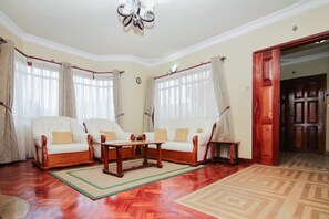 Family House, 5 Bedrooms | Living area | 42-inch flat-screen TV with premium TV channels, LED TV - Ndeiya House (Nairobi)